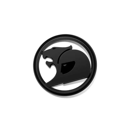 All black round 3D metal badge with a stylised big cat design on a white background