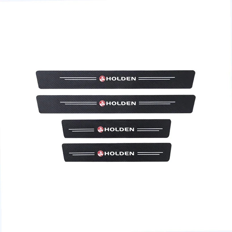 Set of four black carbon fibre Holden door sill protector stickers, two longer and two shorter, with Holden logo and white lines