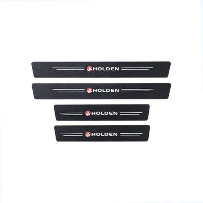 Set of four black carbon fibre Holden door sill protector stickers, two longer and two shorter, with Holden logo and white lines