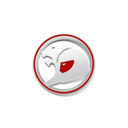 Silver round 3D metal badge with red ring and red accent, stylised big cat design on a white background