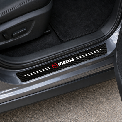 Mazda 5-piece sill protector sticker set laid flat, labelled 2 front door, 2 rear door and 1 trunk piece