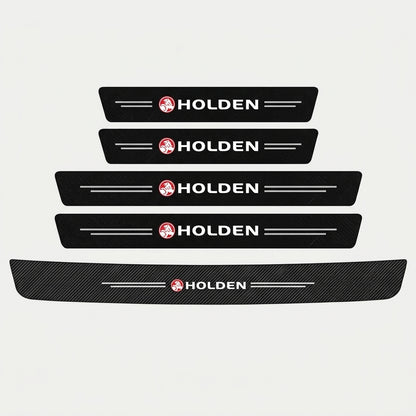 Set of five black carbon fibre Holden door sill protector stickers with Holden logo, four strips in two sizes and one long strip